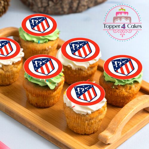 On a wooden tray, there are six cupcakes topped with colorful frosting and adorned with edible toppers showcasing a red and blue striped shield design. In the upper right corner is a logo for Topper 4 Cakes, highlighting our Edible Liverpool Cupcake Topper Personalised for your celebration needs.