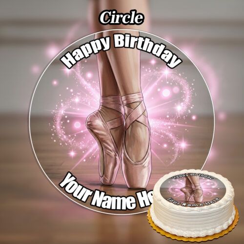 Round birthday cake featuring the Edible Ballerina Cake Topper with ballet pointe shoes and pink sparkles. "Happy Birthday" and your name appear in white letters curved around the cake's edge.